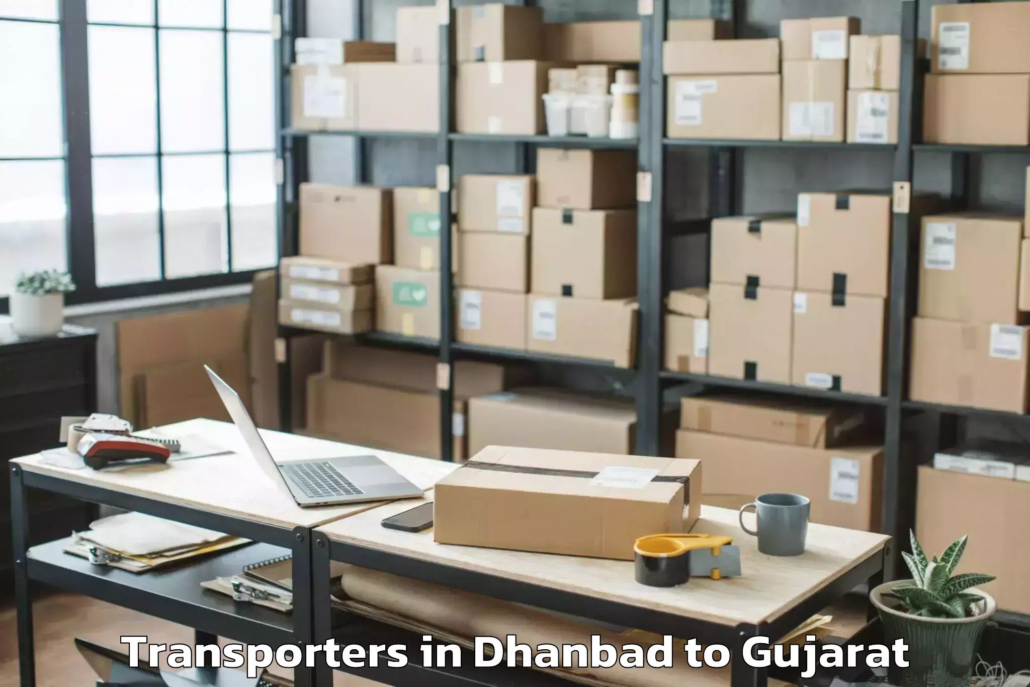 Reliable Dhanbad to Waghai Transporters